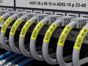 TZe-S231-or-TZE-S221-on-patch-panel-with-cables-identified-with-TZe-SL651-self-laminating-labels-2-300x225-1