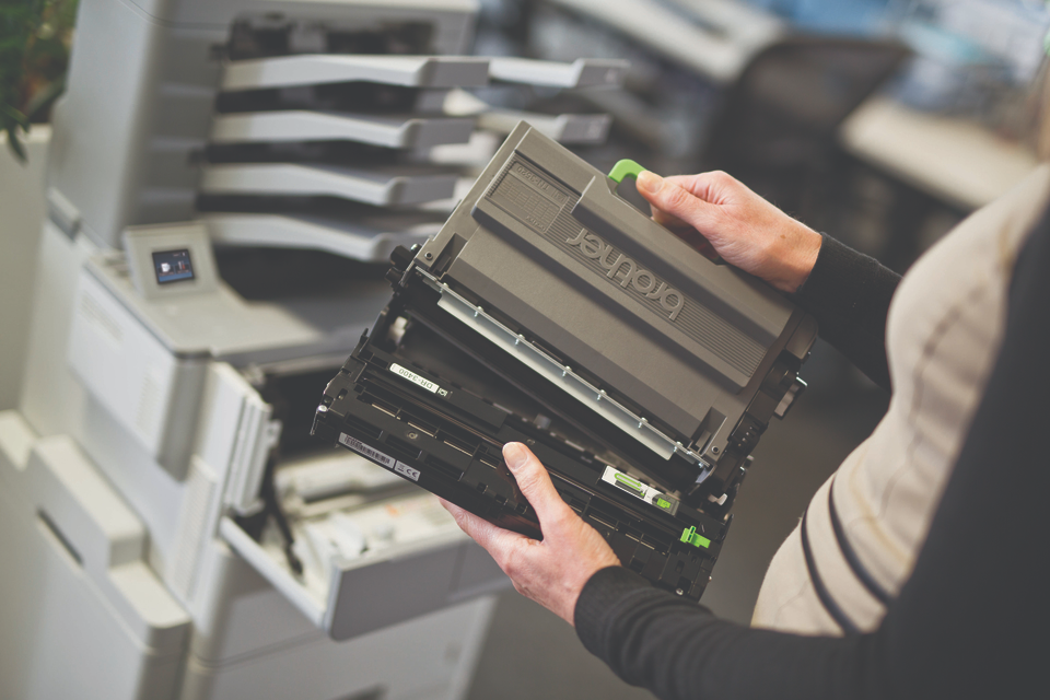 lady holding printer cartridge